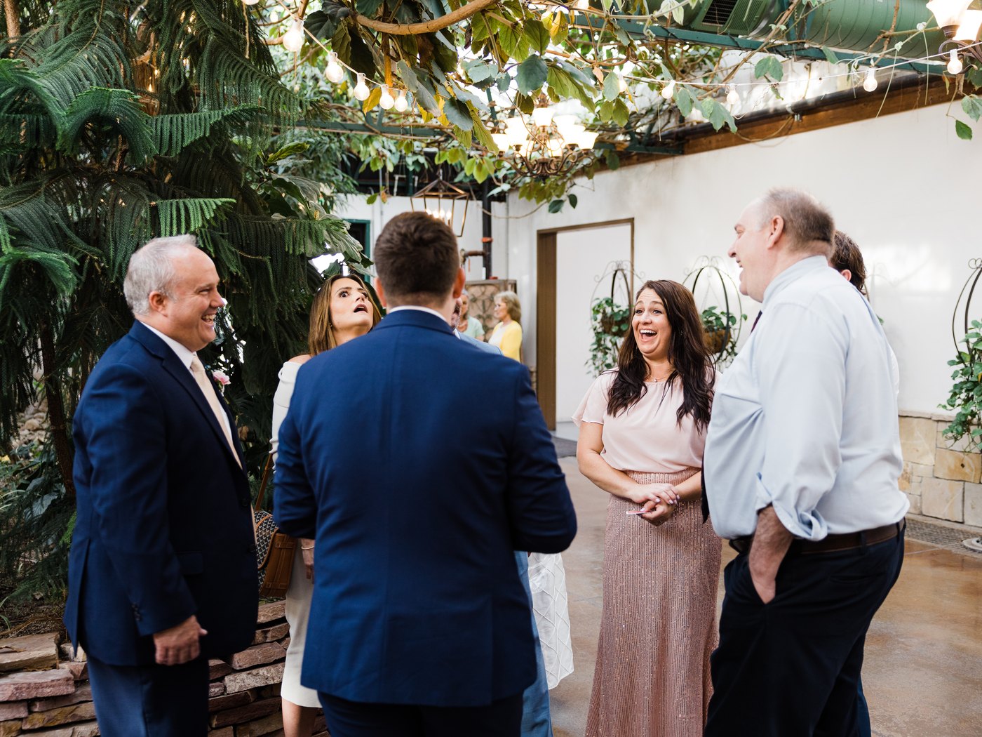 A wedding guest reacting in disbelief during garden reception magic